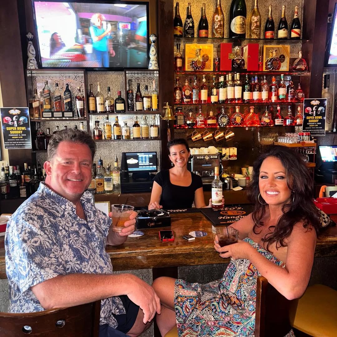 Guests and bartender at the bar at Cigar Republic USA