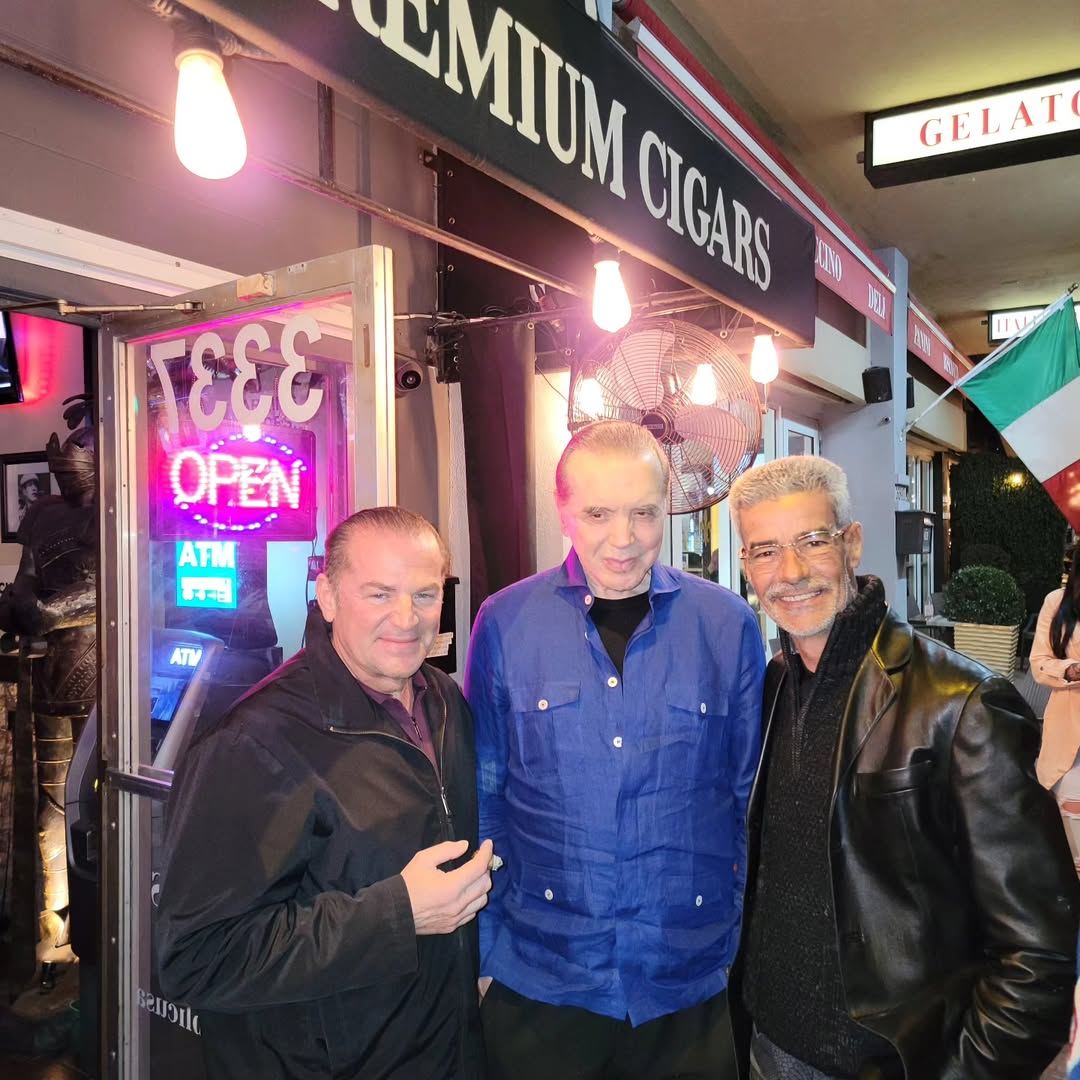 Out front under the Premium Cigars sign